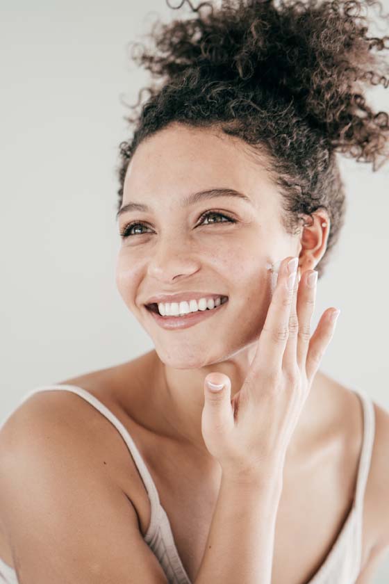 Curly haired woman smiling