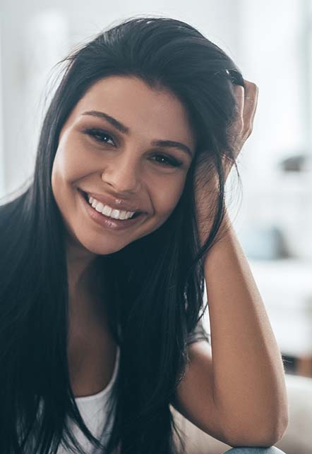 Woman in dark hair smiling