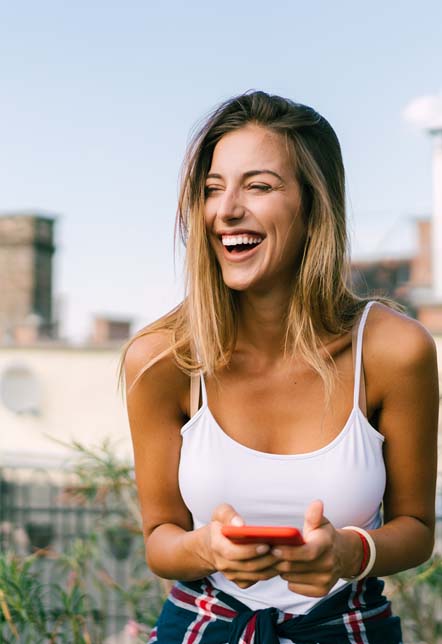 Woman in underwear looking away and smiling