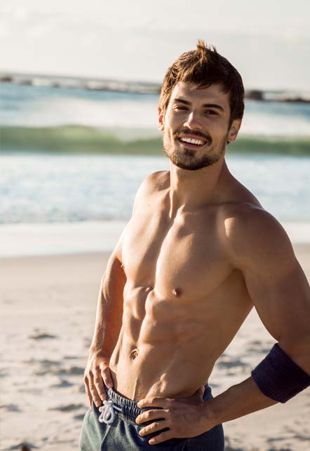 Man taking a break from exercising along the beach